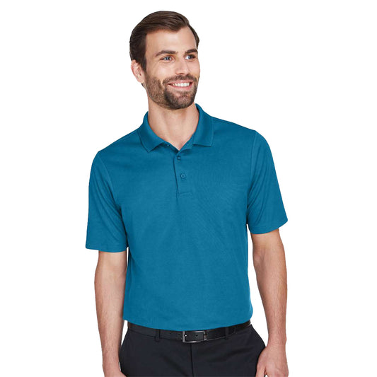 Model wearing a dark teal Devon & Jones DG20 CrownLux polo