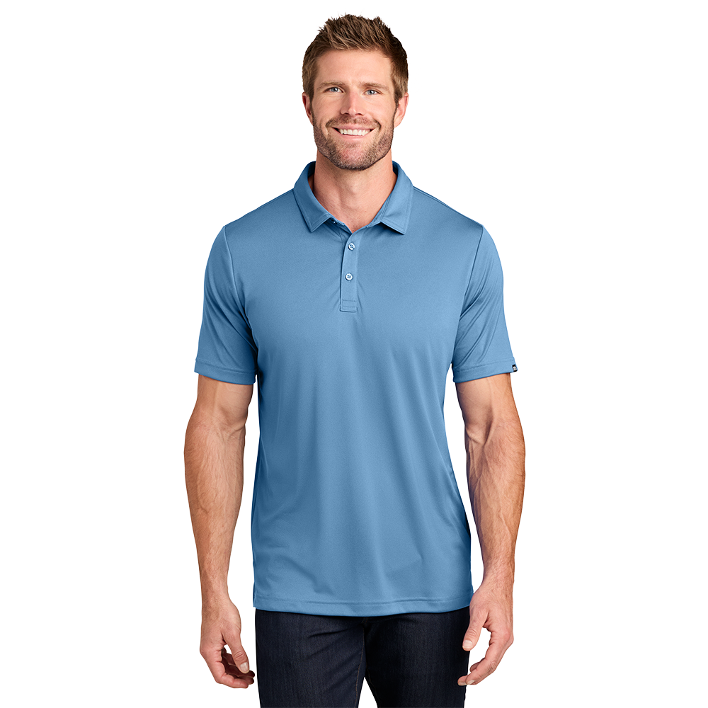 Model wearing a federal blue TravisMathew Coto polo