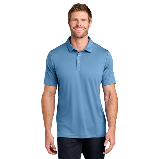 Model wearing a federal blue TravisMathew Coto polo