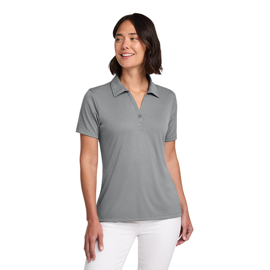 Model wearing a grey heather TravisMathew women's Coto polo