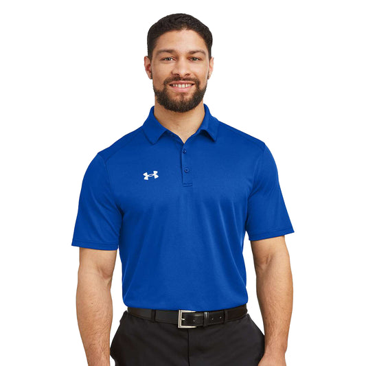 Model wearing a royal and white Under Armour Tech polo